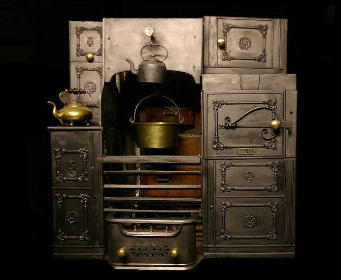 Vintage iron stove display at Cardigan Castle with antique kitchenware